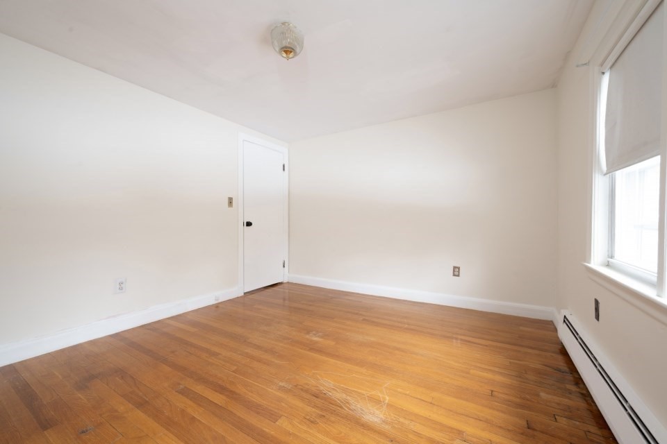 193 Vincent Road Dedham, MA 02026 - Photo 35 of 42 an empty room with wooden floor