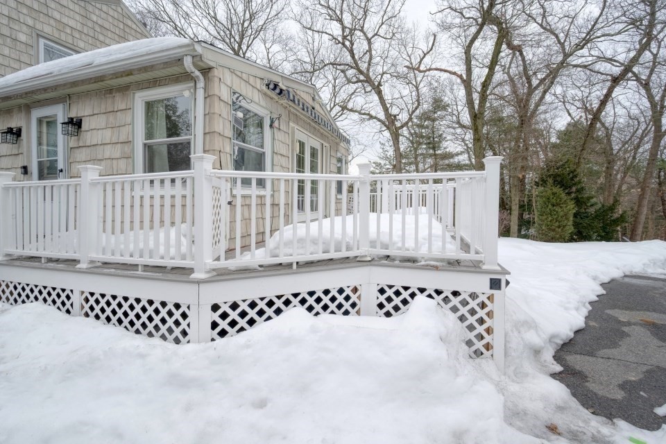 193 Vincent Road Dedham, MA 02026 - Photo 38 of 42 a view of a house with a wooden fence