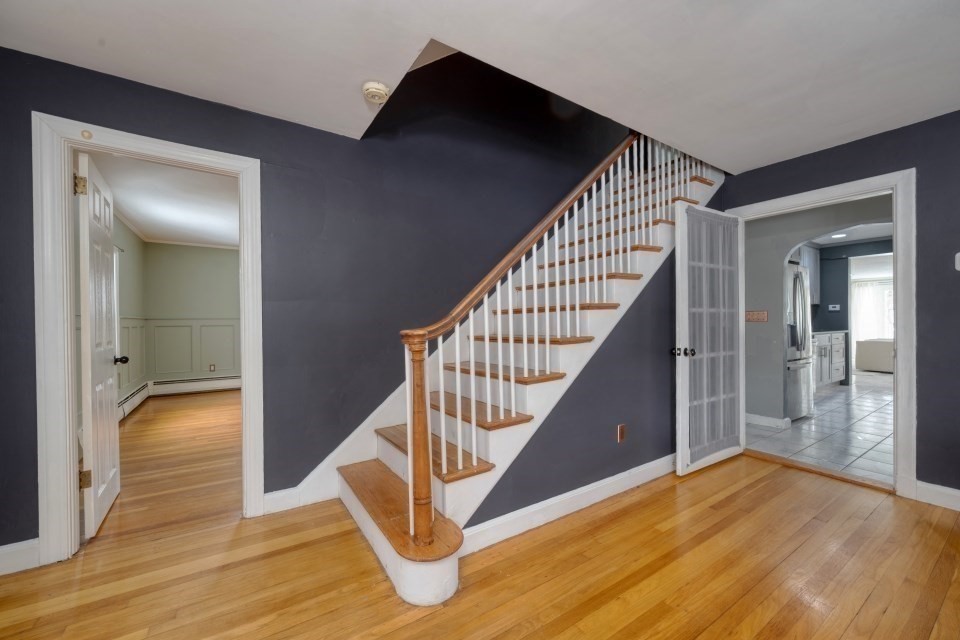 193 Vincent Road Dedham, MA 02026 - Photo 6 of 42 a view of entryway and hall with wooden floor