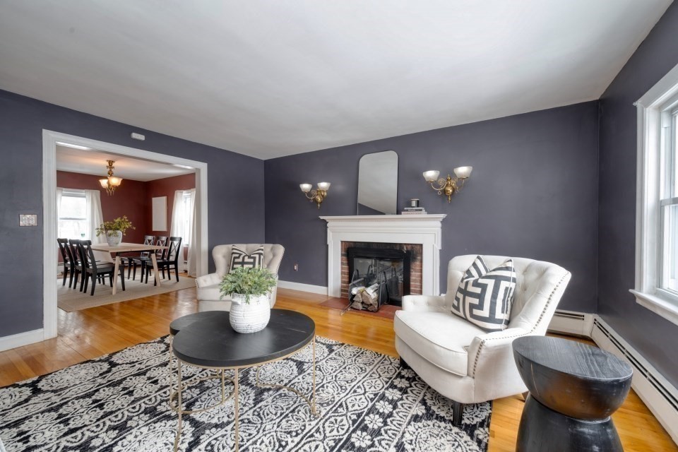 193 Vincent Road Dedham, MA 02026 - Photo 8 of 42 a living room with furniture a fireplace and a table