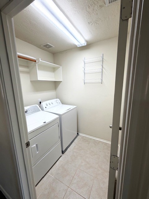 71 East Stedhill Loop Conroe, TX 77384 - Photo 3 of 10 a utility room with dryer and washer