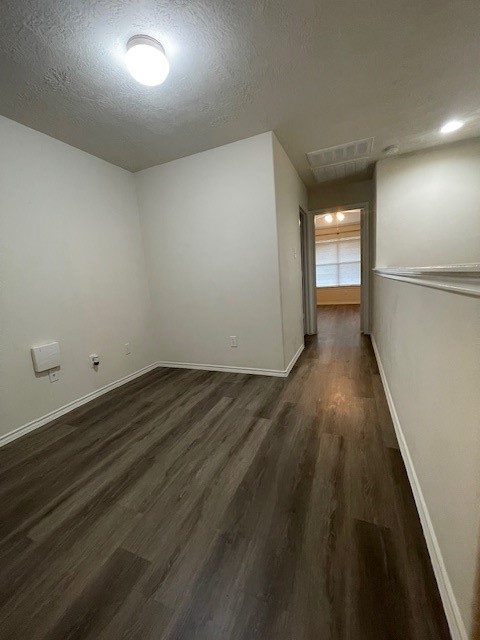 71 East Stedhill Loop Conroe, TX 77384 - Photo 5 of 10 an empty room with wooden floor and windows