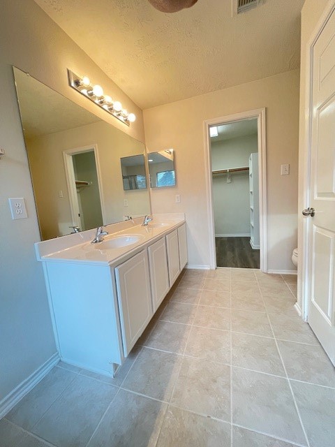 71 East Stedhill Loop Conroe, TX 77384 - Photo 8 of 10 a bathroom with a sink and a mirror