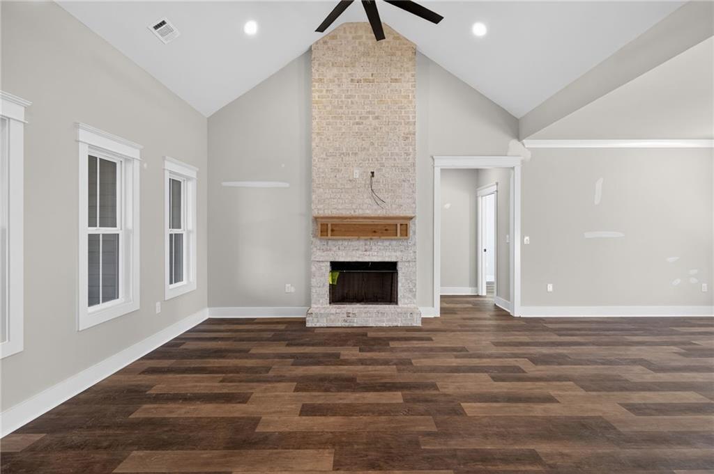 2203 Ridge Road Douglasville, GA 30134 - Photo 11 of 39 a view of a livingroom with wooden floor and a fireplace