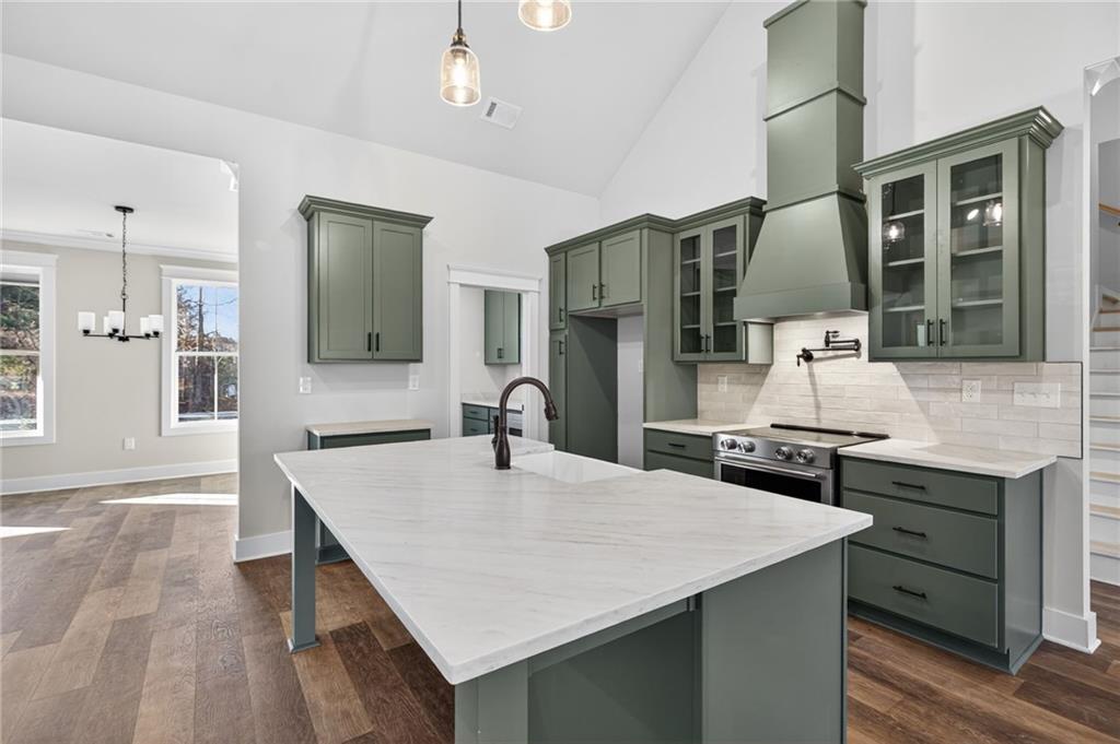 2203 Ridge Road Douglasville, GA 30134 - Photo 13 of 39 a kitchen with kitchen island a sink stove and refrigerator