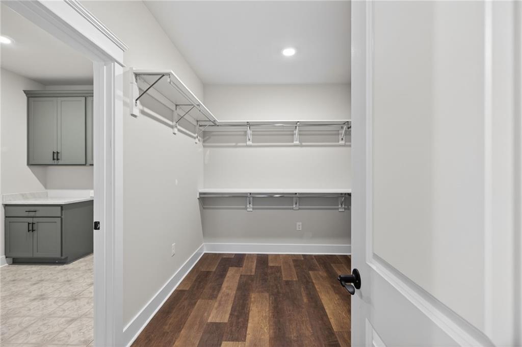 2203 Ridge Road Douglasville, GA 30134 - Photo 23 of 39 a view of walk in closet with empty racks