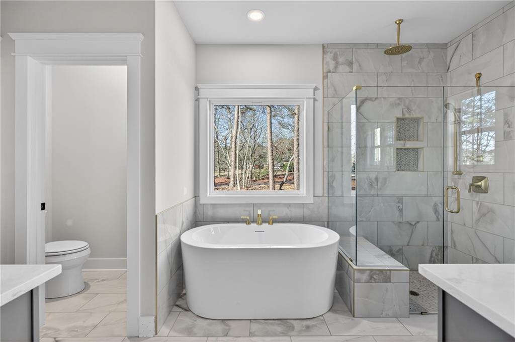 2203 Ridge Road Douglasville, GA 30134 - Photo 25 of 39 a bathroom with a bathtub and shower