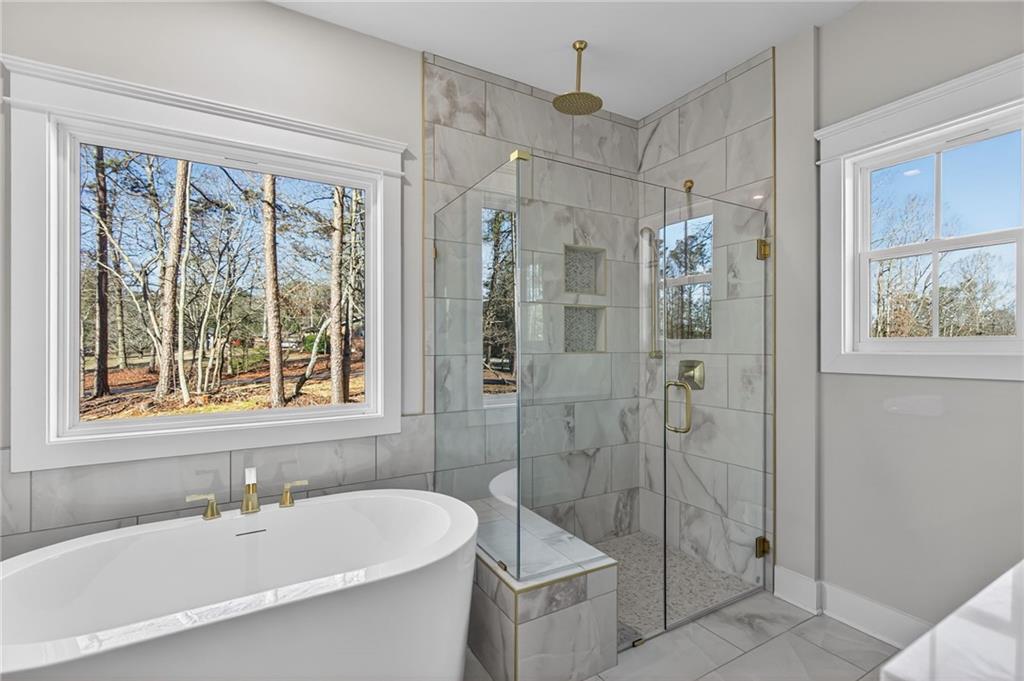 2203 Ridge Road Douglasville, GA 30134 - Photo 26 of 39 a bathroom with a sink toilet and shower