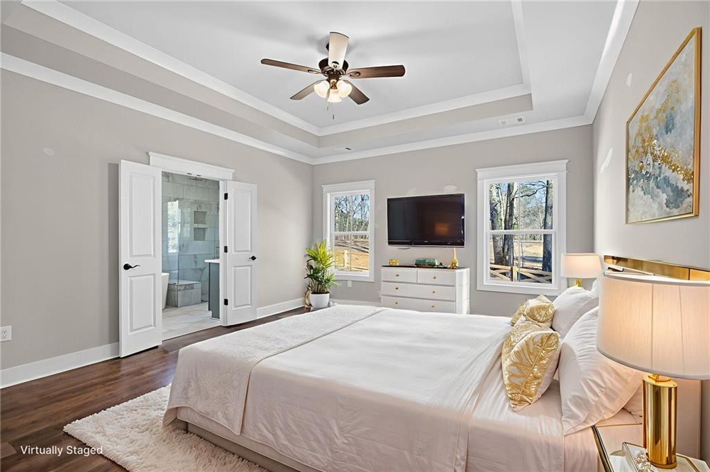 2203 Ridge Road Douglasville, GA 30134 - Photo 28 of 39 a bedroom with a bed outdoor view and a flat screen tv