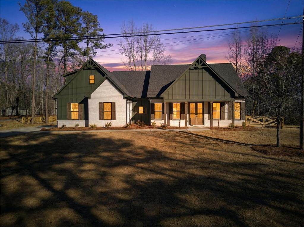 2203 Ridge Road Douglasville, GA 30134 - Photo 3 of 39 a front view of a house with a garden