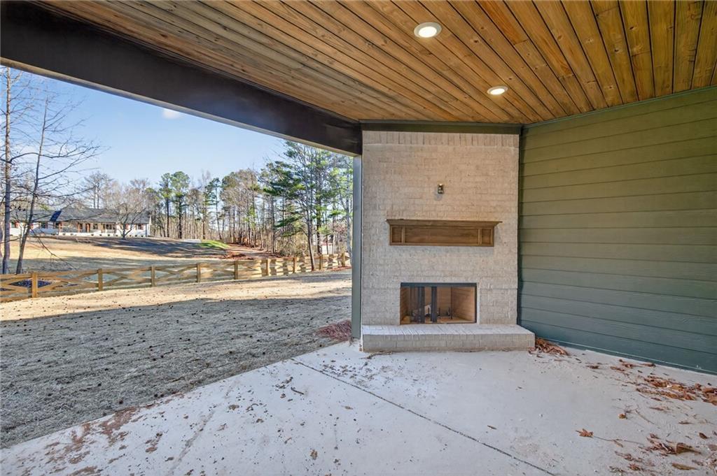 2203 Ridge Road Douglasville, GA 30134 - Photo 33 of 39 a view of an empty room with a fireplace and a window
