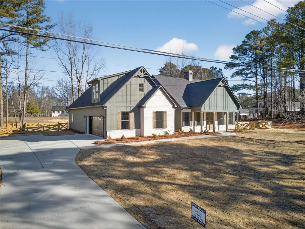2203 Ridge Road Douglasville, GA 30134 - Photo 5 of 39 a front view of a house with a yard