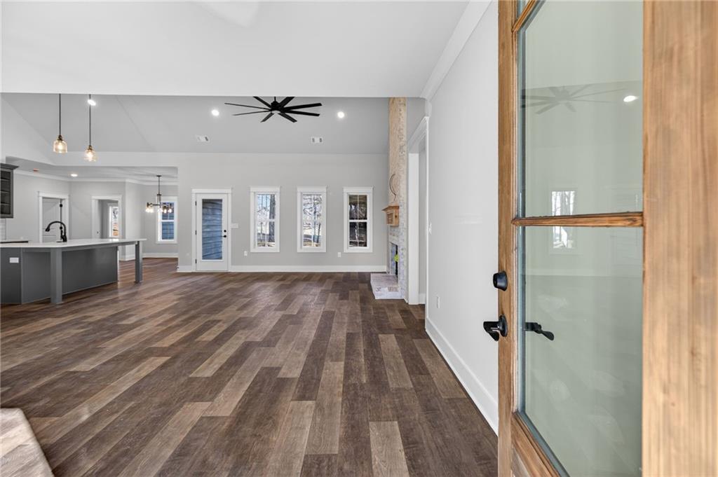 2203 Ridge Road Douglasville, GA 30134 - Photo 6 of 39 wooden floor in a hall with a dining table & chairs