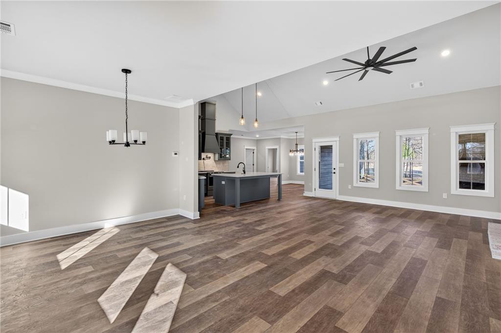 2203 Ridge Road Douglasville, GA 30134 - Photo 7 of 39 a view of a kitchen with a sink and dishwasher wooden floor and window