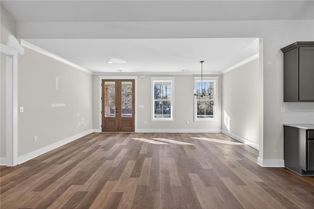 2203 Ridge Road Douglasville, GA 30134 - Photo 10 of 39 a view of an empty room with window and wooden floor