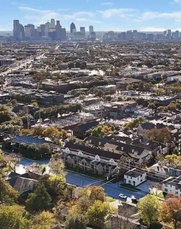 an aerial view of residential building and lake