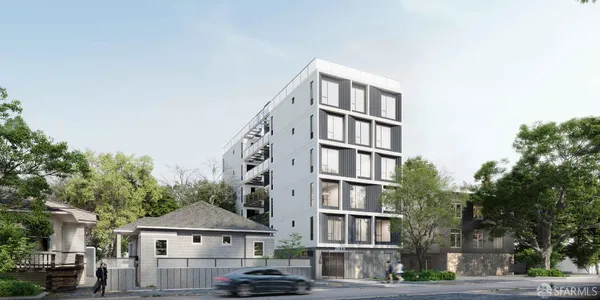 a front view of a residential apartment building with a yard