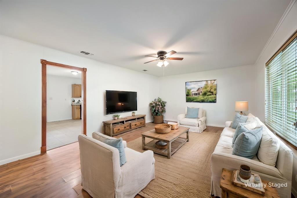 571 South 1st Street Point, TX 75472 - Photo 5 of 27 a living room with furniture and a flat screen tv