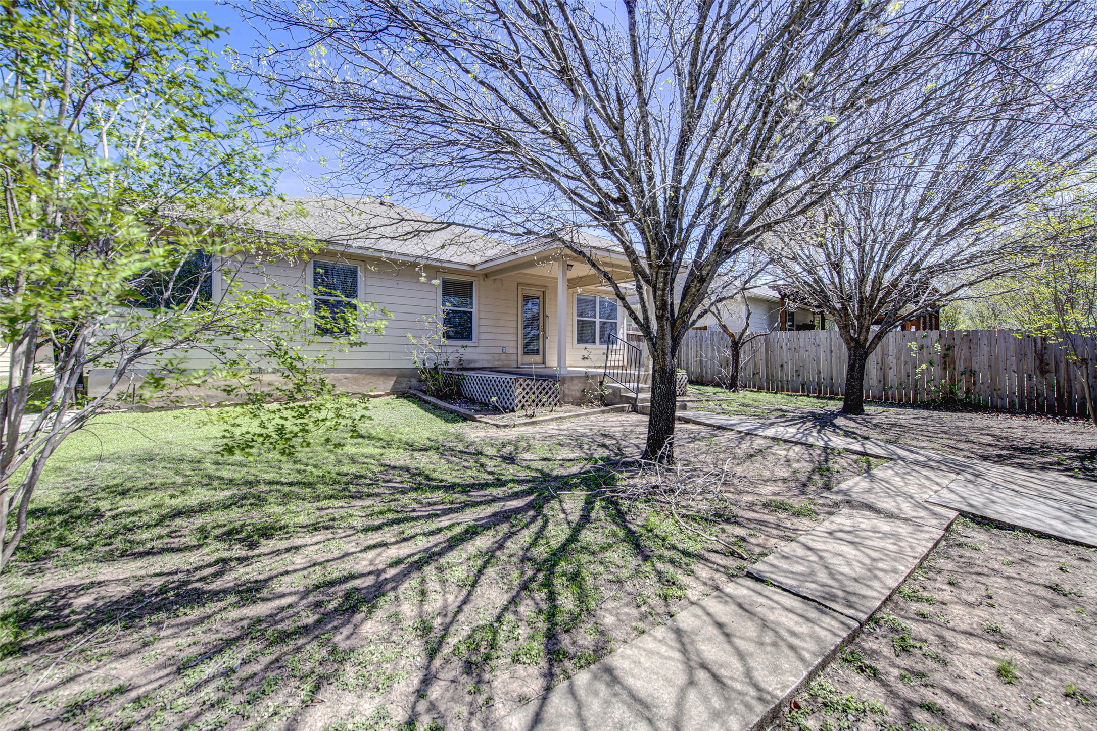 2090 Intrepid Drive Buda, TX 78610 - Photo 22 of 24 Rear view of house featuring a patio area and a wooden deck