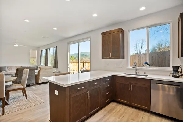 a kitchen with a sink and large window