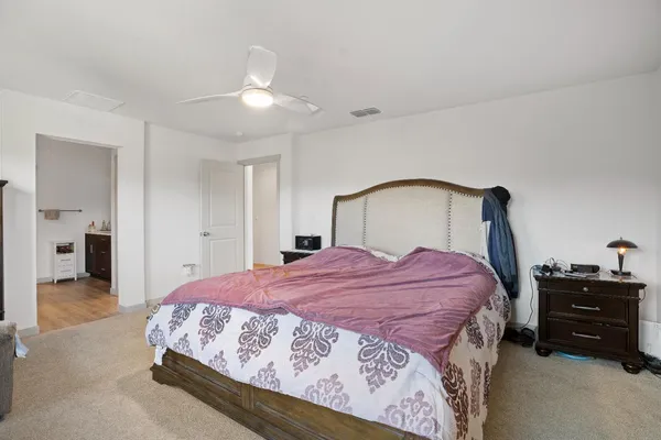 a bedroom with a bed and a closet