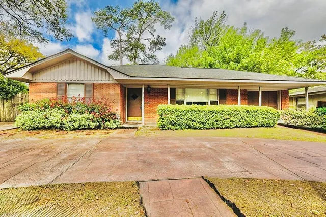 a house with trees in the background