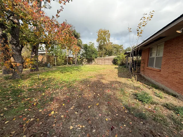 a view of a yard with an outdoor space