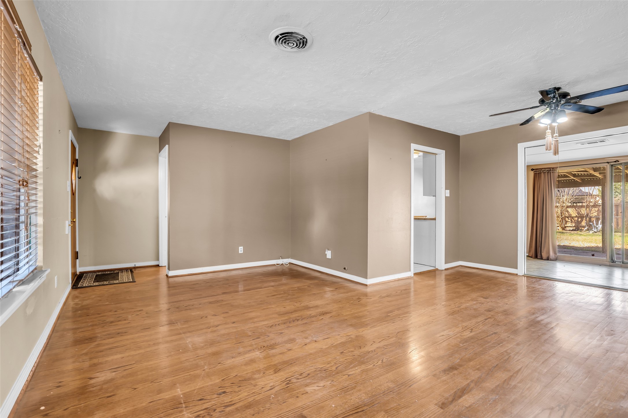 4825 Ella Boulevard Houston, TX 77018 - Photo 6 of 27 wooden floor in an empty room with a window