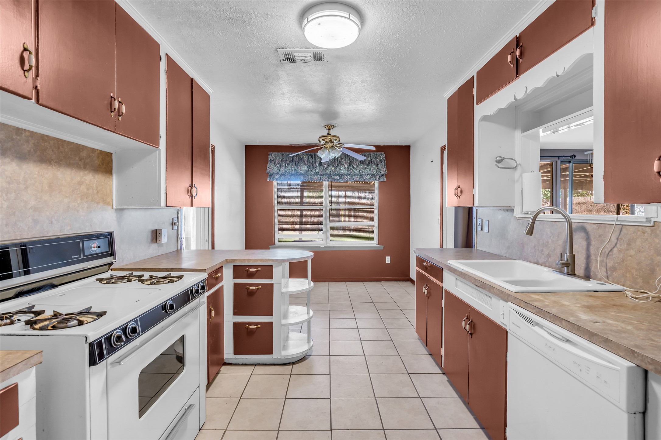 4825 Ella Boulevard Houston, TX 77018 - Photo 9 of 27 a kitchen with a stove and a sink