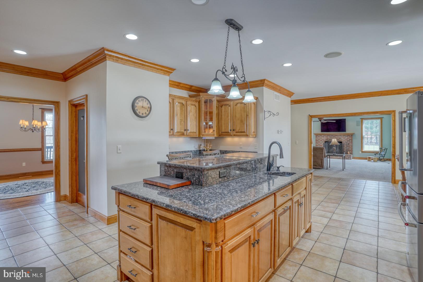 520 Mud Mill Road Marydel, DE 19964 - Photo 27 of 123 a kitchen with a sink a counter and a view of living room