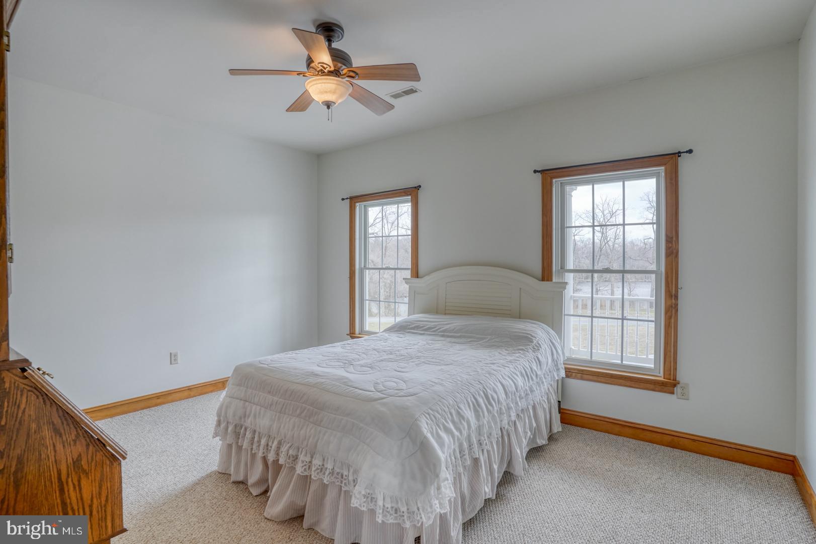 520 Mud Mill Road Marydel, DE 19964 - Photo 51 of 123 a bedroom with a bed and a chandelier