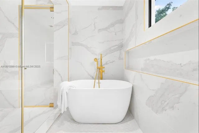 a bathroom with a shower sink and mirror