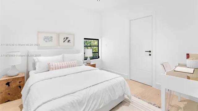 a view of a patio with couches table and chairs with potted plants