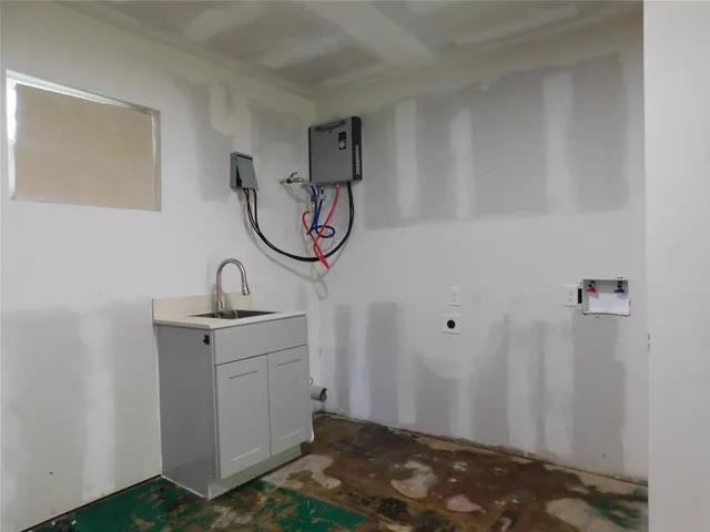 a bathroom with a sink and cabinets