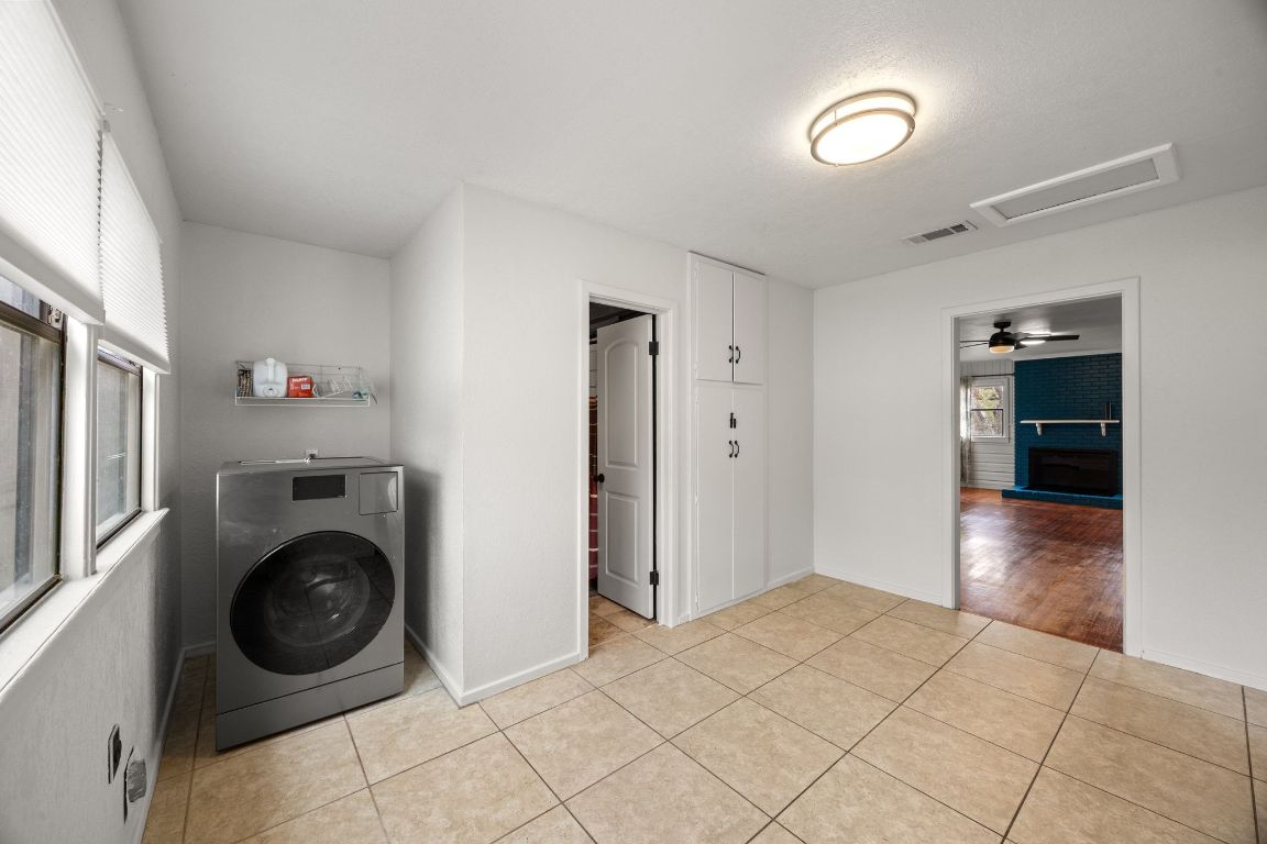1815 Eckhardt Street Taylor, TX 76574 - Photo 14 of 33 a view of a bedroom with washer and dryer