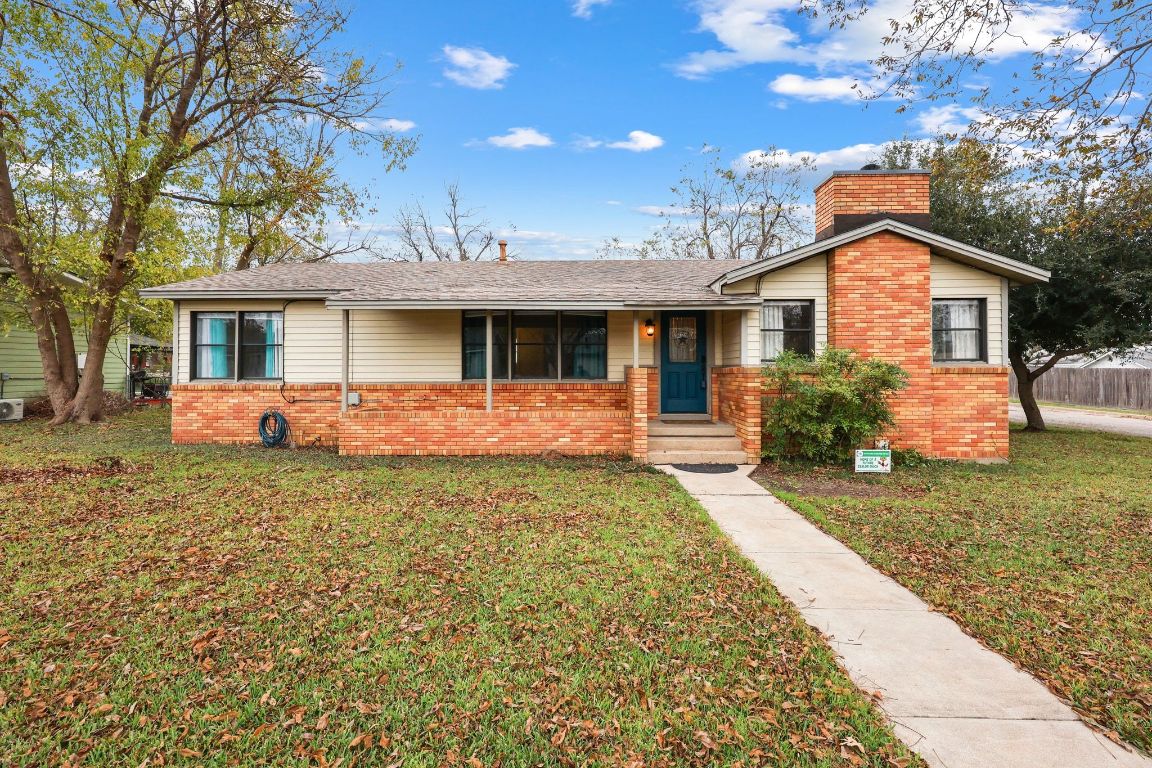 1815 Eckhardt Street Taylor, TX 76574 - Photo 2 of 33 a front view of a house with garden