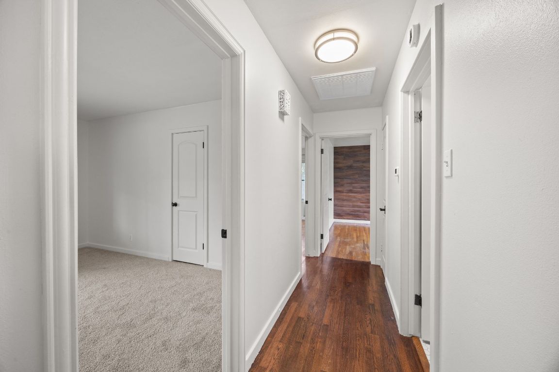 1815 Eckhardt Street Taylor, TX 76574 - Photo 21 of 33 a view of a hallway with wooden floor