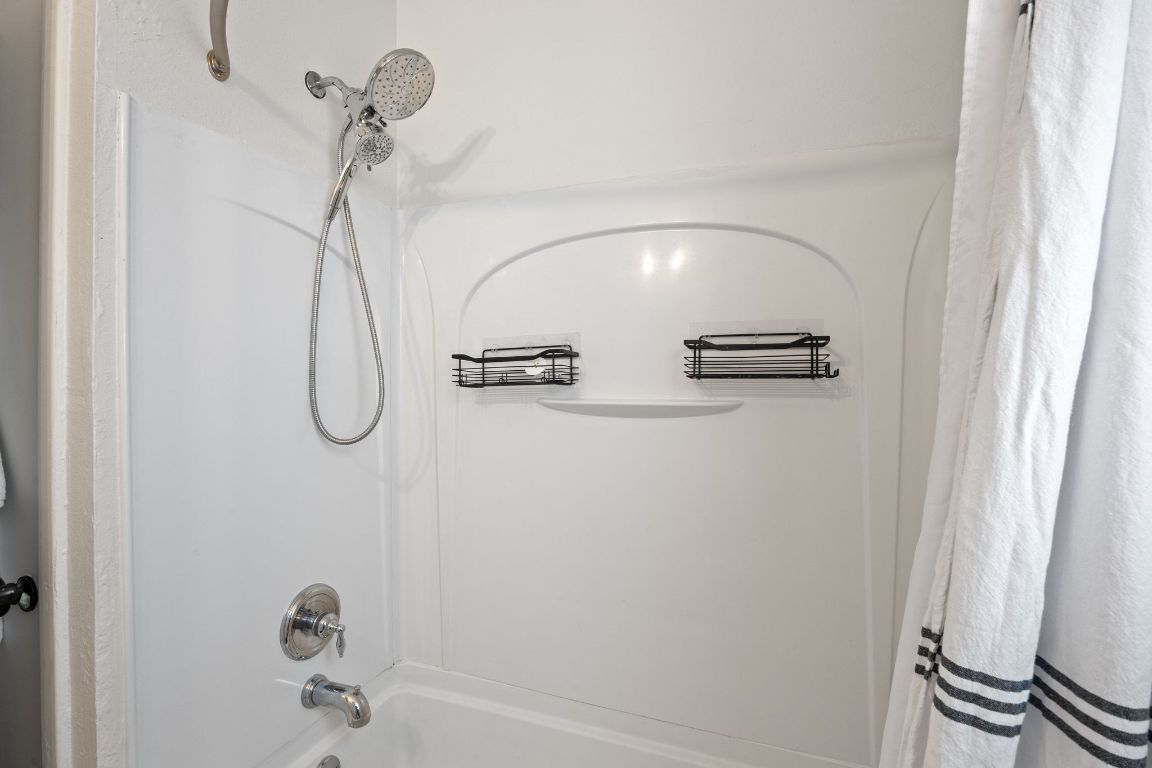 1815 Eckhardt Street Taylor, TX 76574 - Photo 24 of 33 a bathroom with a shower