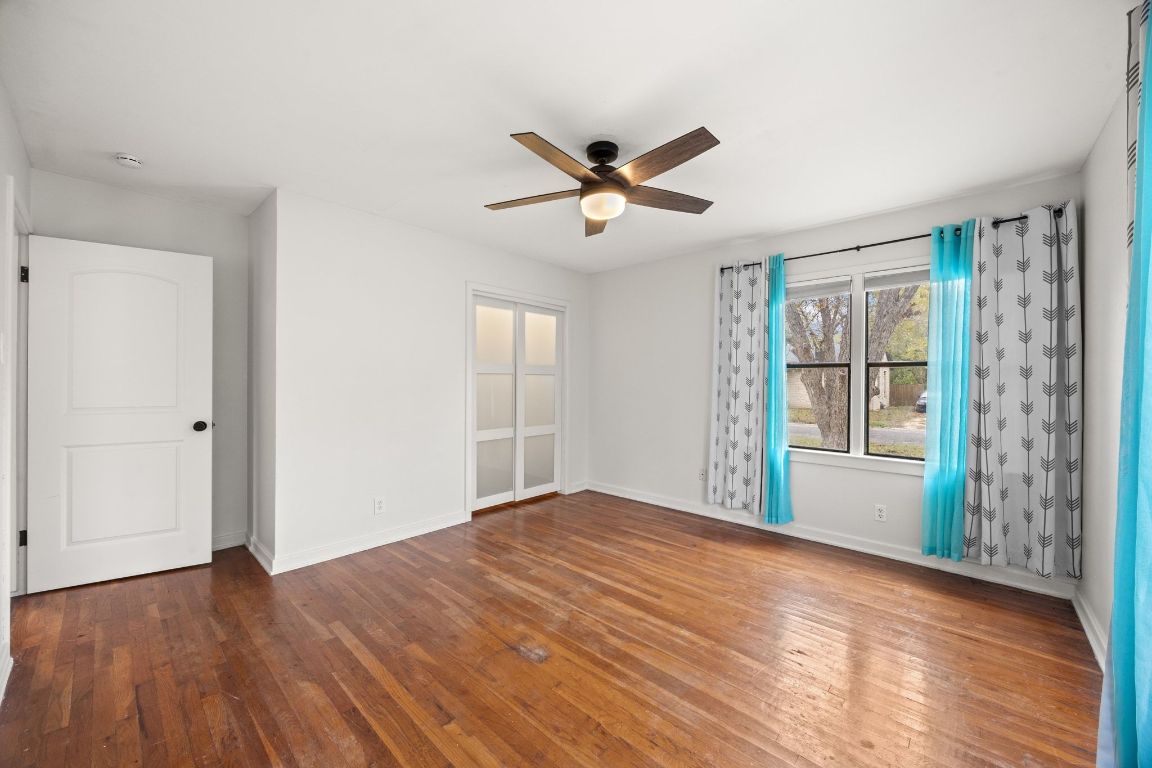 1815 Eckhardt Street Taylor, TX 76574 - Photo 28 of 33 a view of empty room with wooden floor and fan