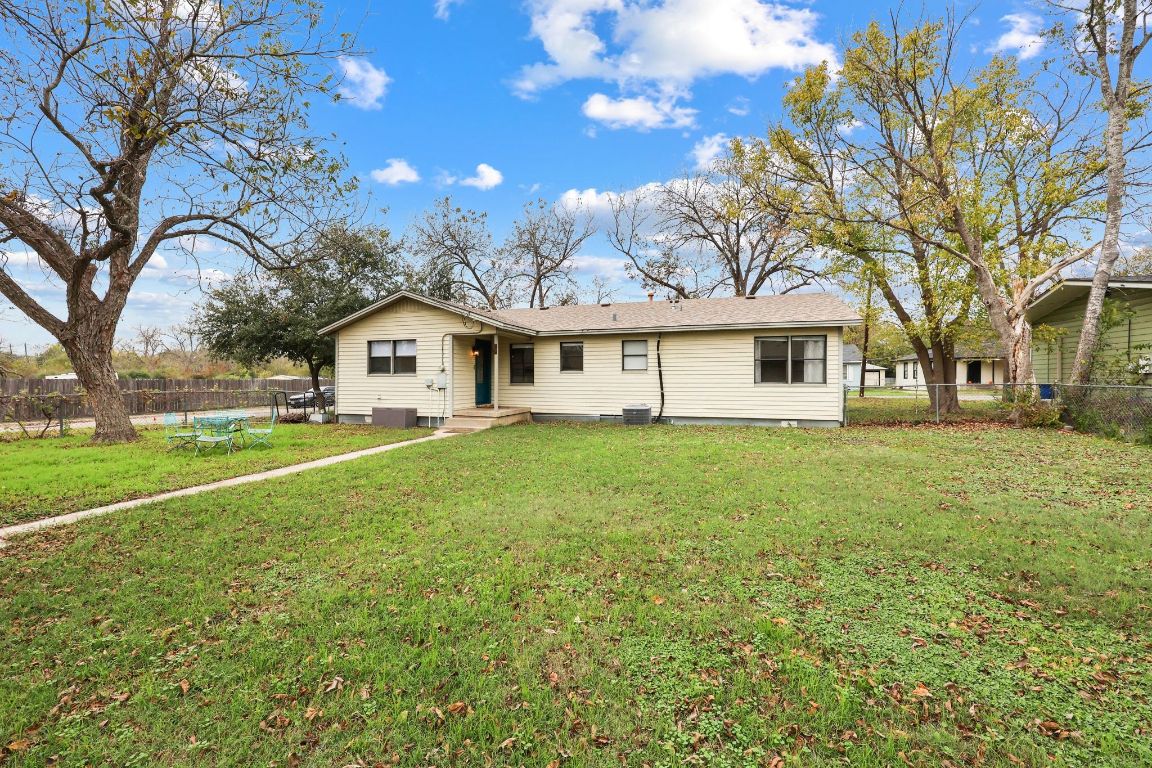 1815 Eckhardt Street Taylor, TX 76574 - Photo 29 of 33 a front view of a house with yard and green space