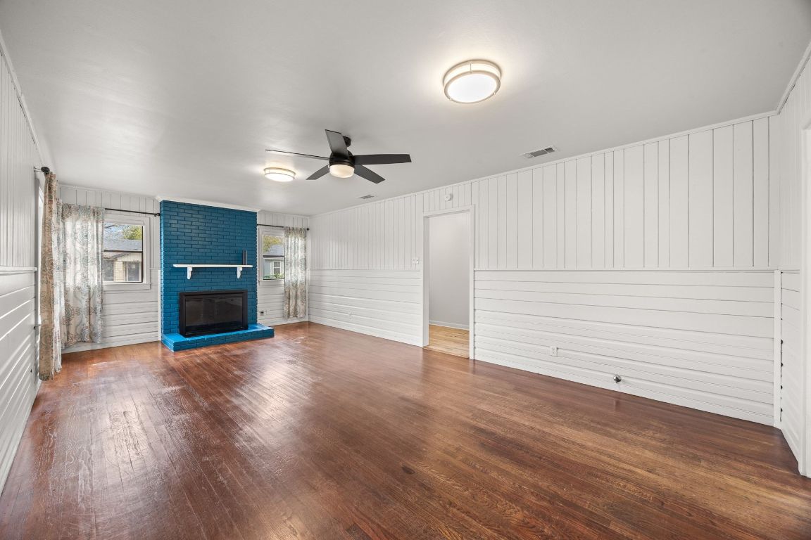 1815 Eckhardt Street Taylor, TX 76574 - Photo 7 of 33 a view of a room with wooden floor and ceiling fan