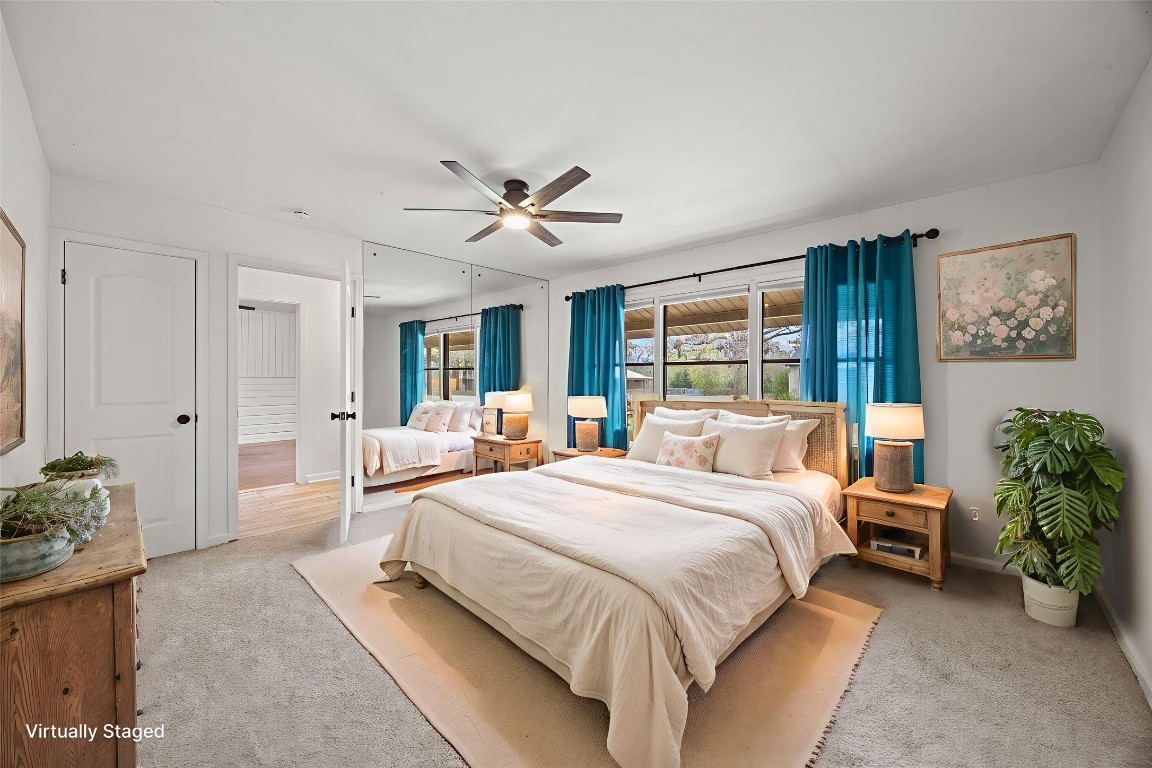 1815 Eckhardt Street Taylor, TX 76574 - Photo 9 of 33 a spacious bedroom with a bed a couch and a potted plant