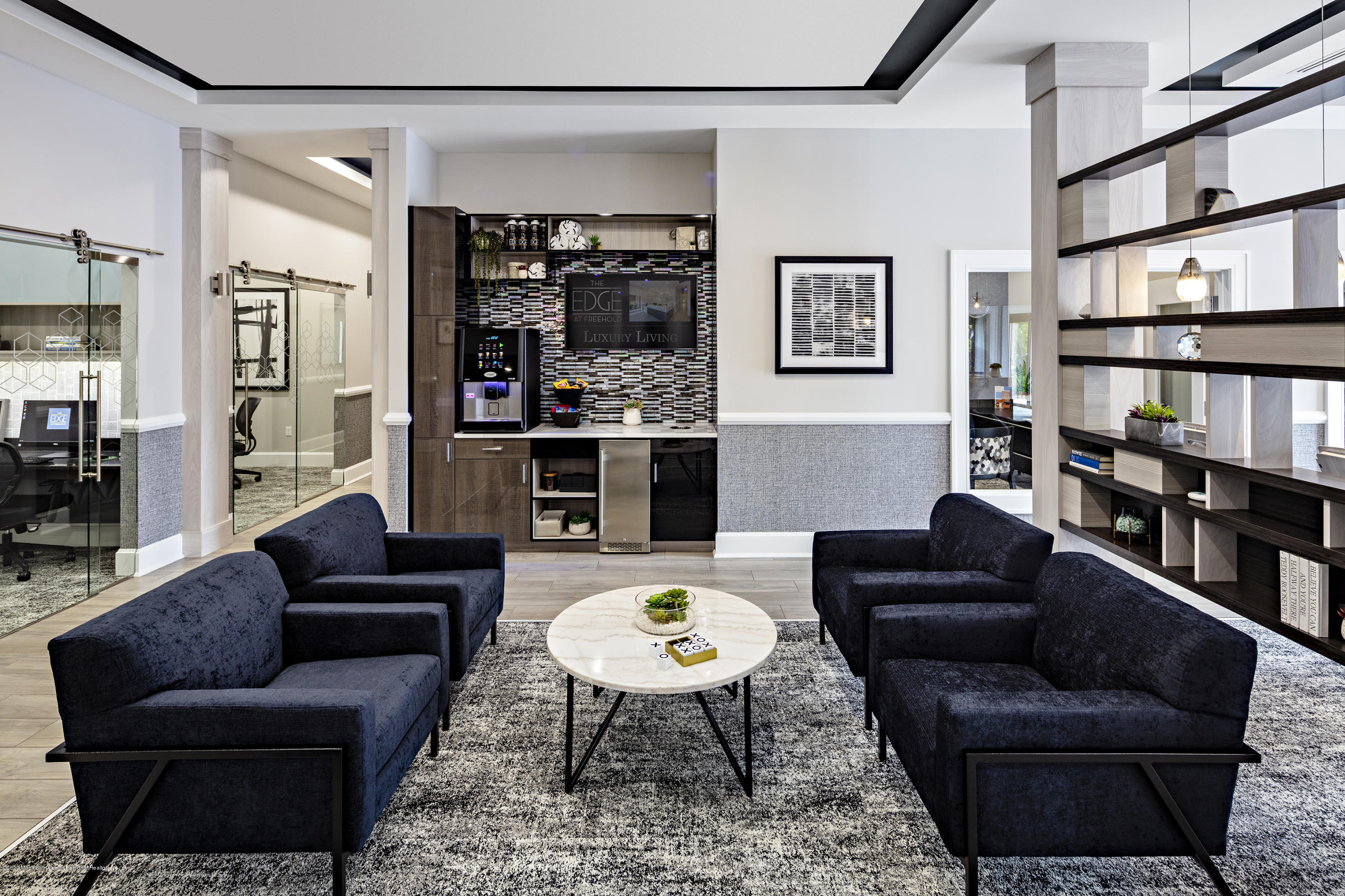 627 Jessica Circle Freehold, NJ 07728 - Photo 2 of 15 a living room with furniture a rug and a bookshelf