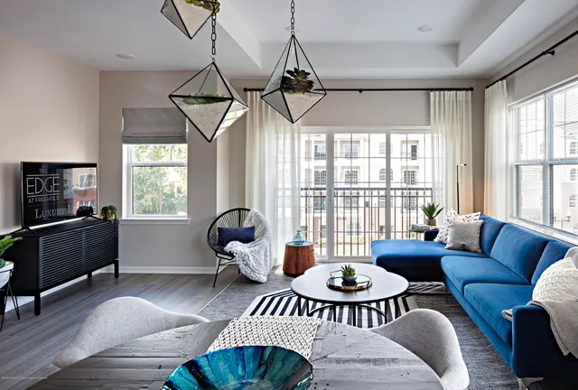 a kitchen with a refrigerator a sink dishwasher stove and oven with wooden floor