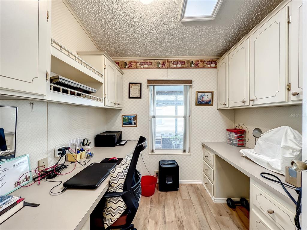 6518 Raintree Lane Winter Haven, FL 33881 - Photo 15 of 42 a kitchen with stainless steel appliances a stove a sink and cabinets