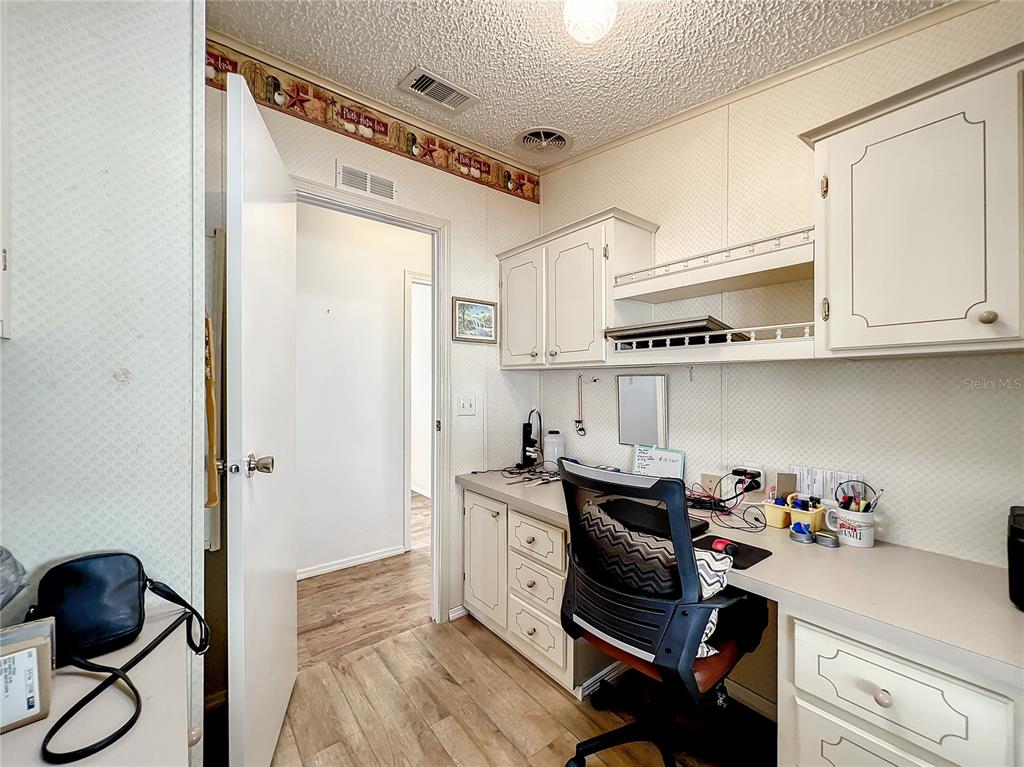 6518 Raintree Lane Winter Haven, FL 33881 - Photo 16 of 42 a view of a workspace with furniture and a window