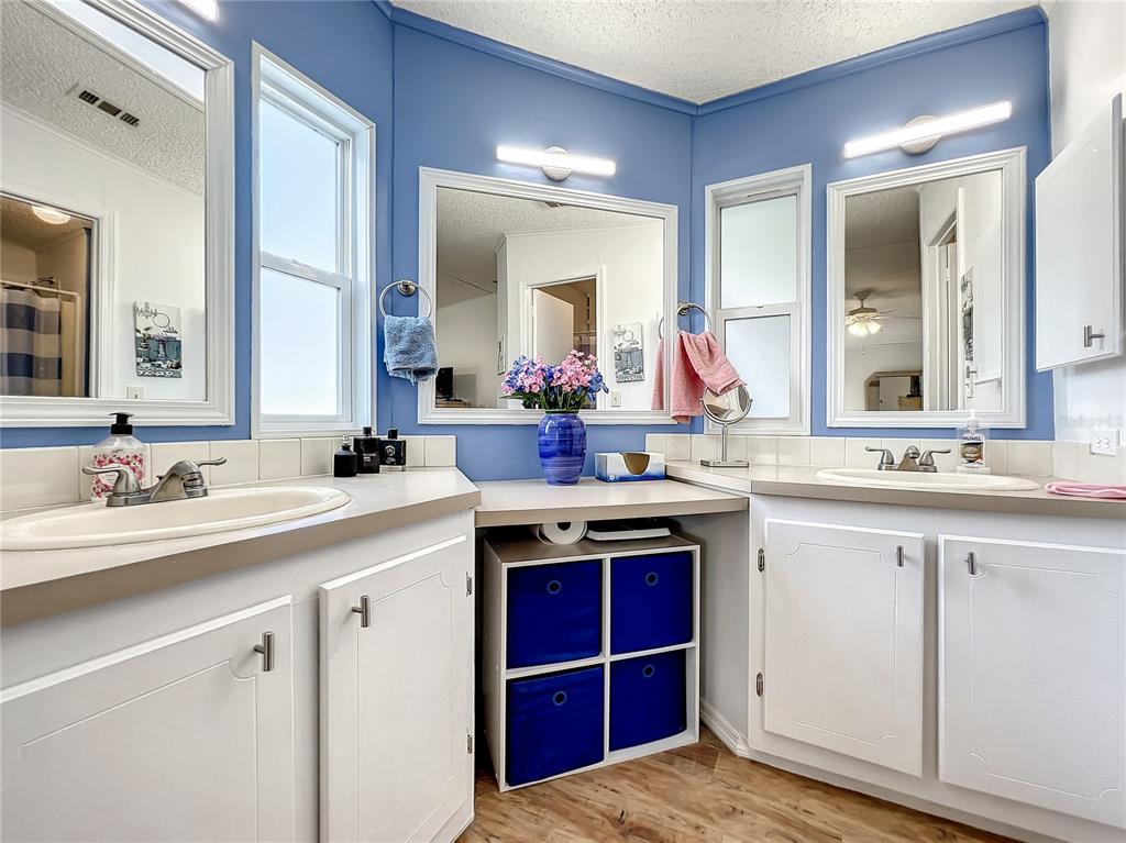 6518 Raintree Lane Winter Haven, FL 33881 - Photo 24 of 42 a bathroom with a sink and a mirror