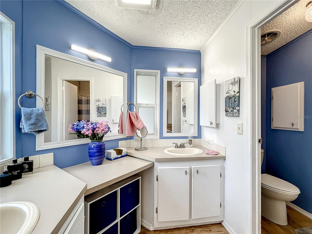 6518 Raintree Lane Winter Haven, FL 33881 - Photo 25 of 42 a view of bathroom with a sink and mirror with toilet