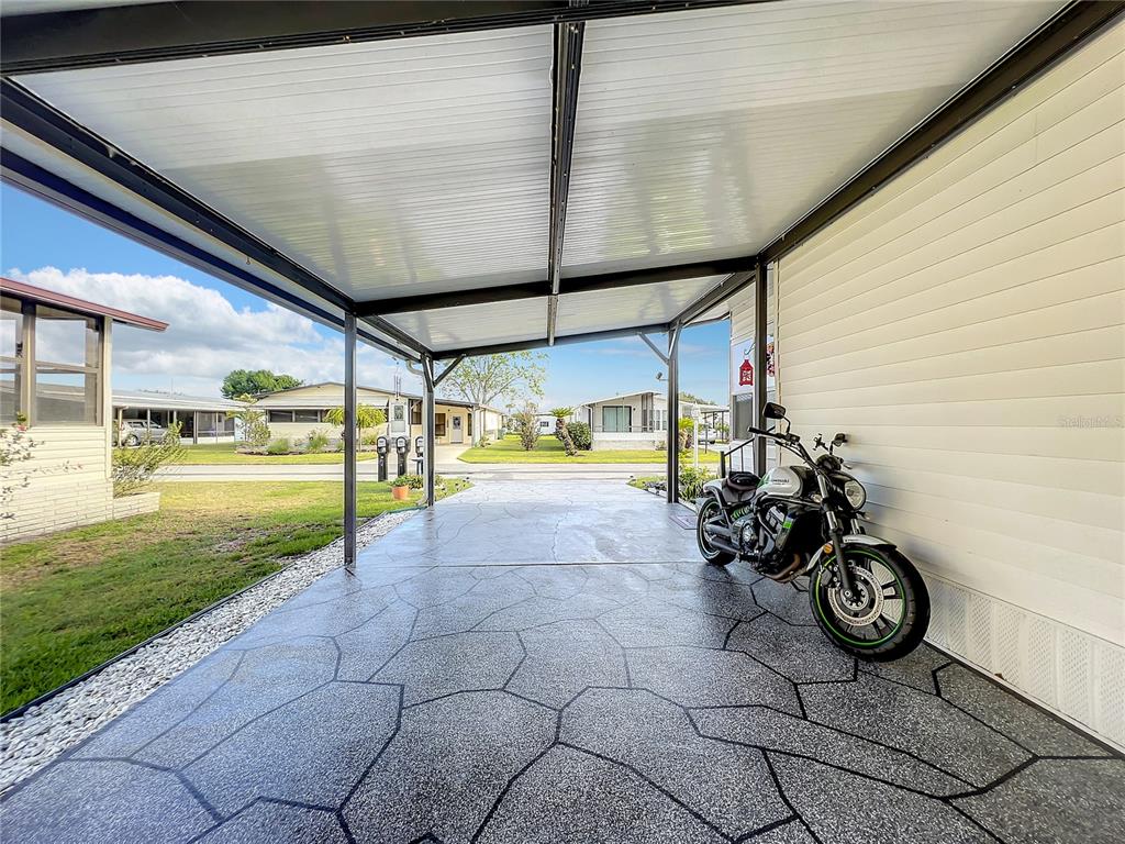 6518 Raintree Lane Winter Haven, FL 33881 - Photo 28 of 42 a view of a porch with furniture