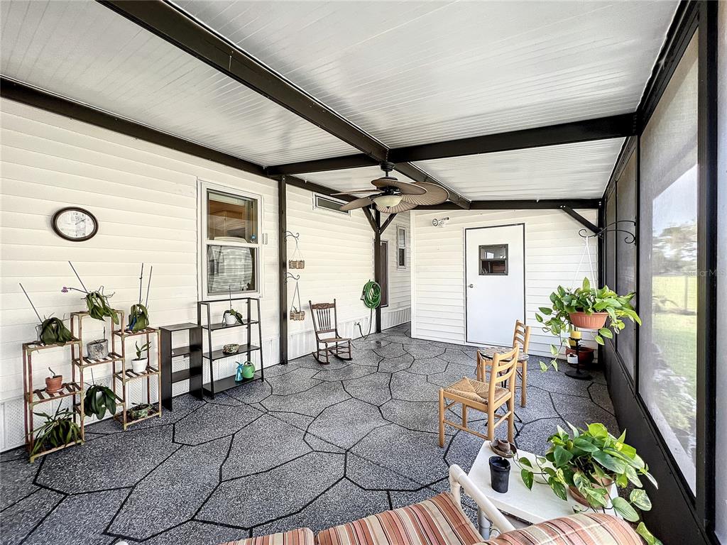 6518 Raintree Lane Winter Haven, FL 33881 - Photo 29 of 42 a outdoor space with lots of white furniture